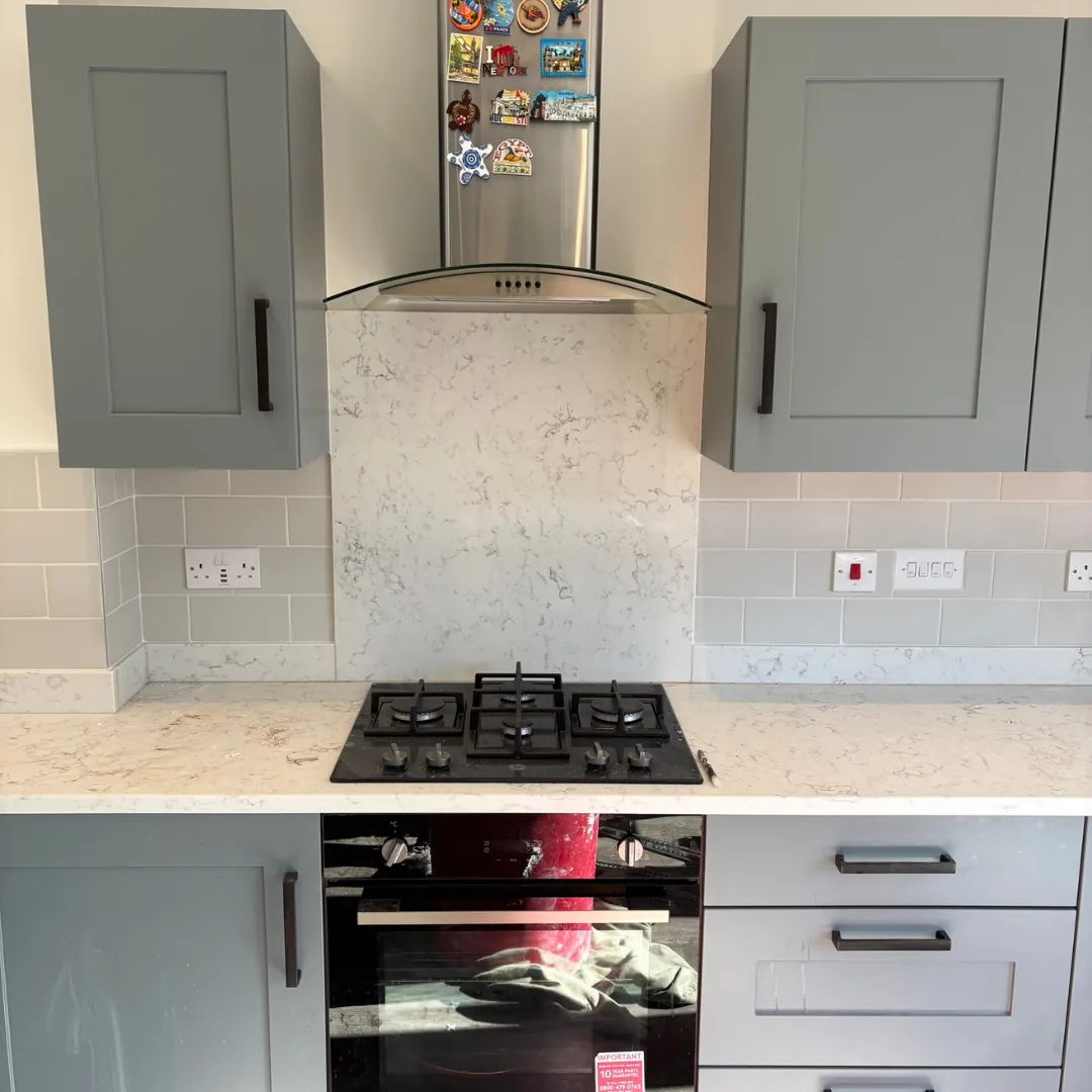 Kitchen splashback tiling behind a hob by LN Ceramics