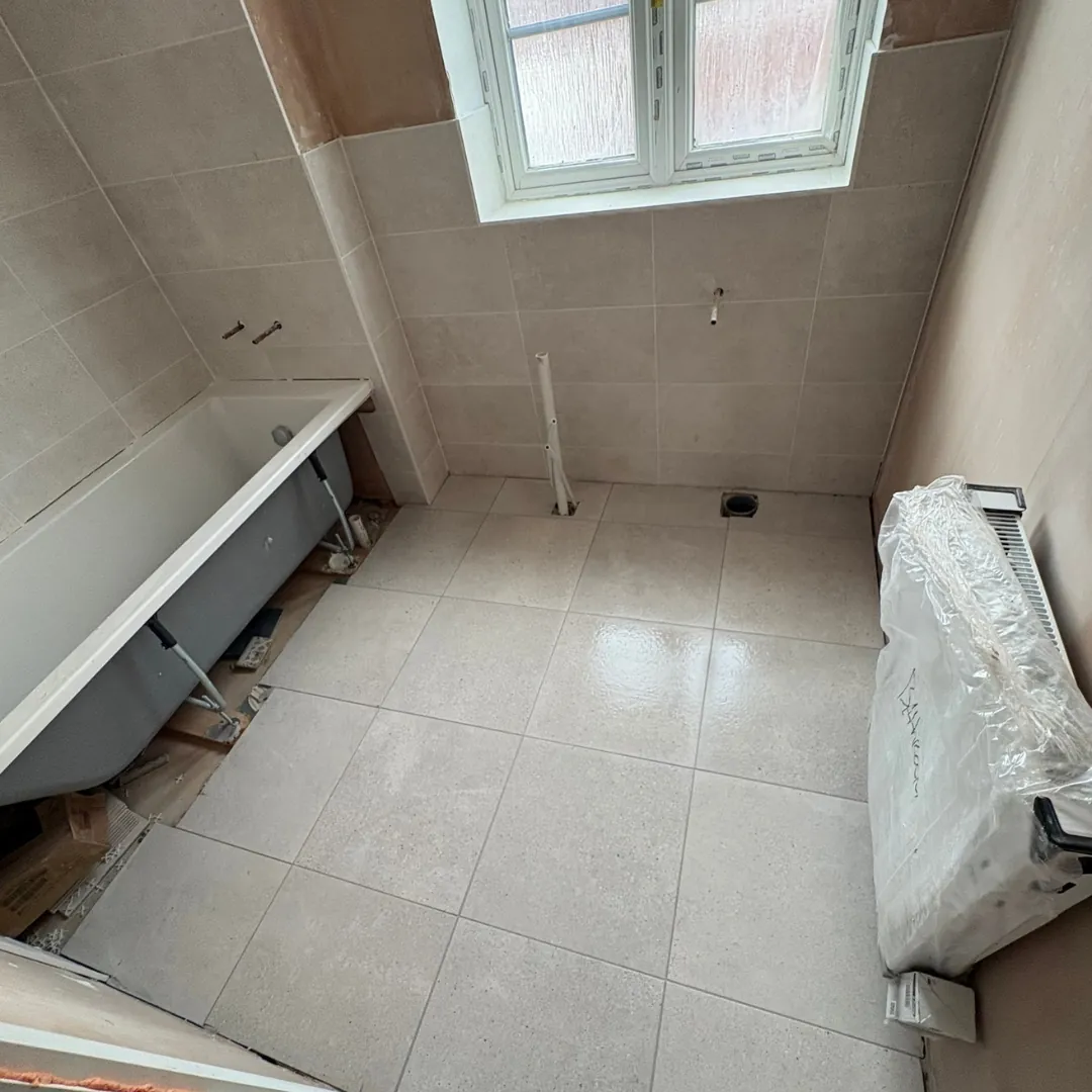 Bathroom wall and floor tiling with window by LN Ceramics